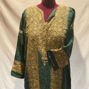 Ethnic, floor length, long sleeve dress. Green with gold trim that sparkles.